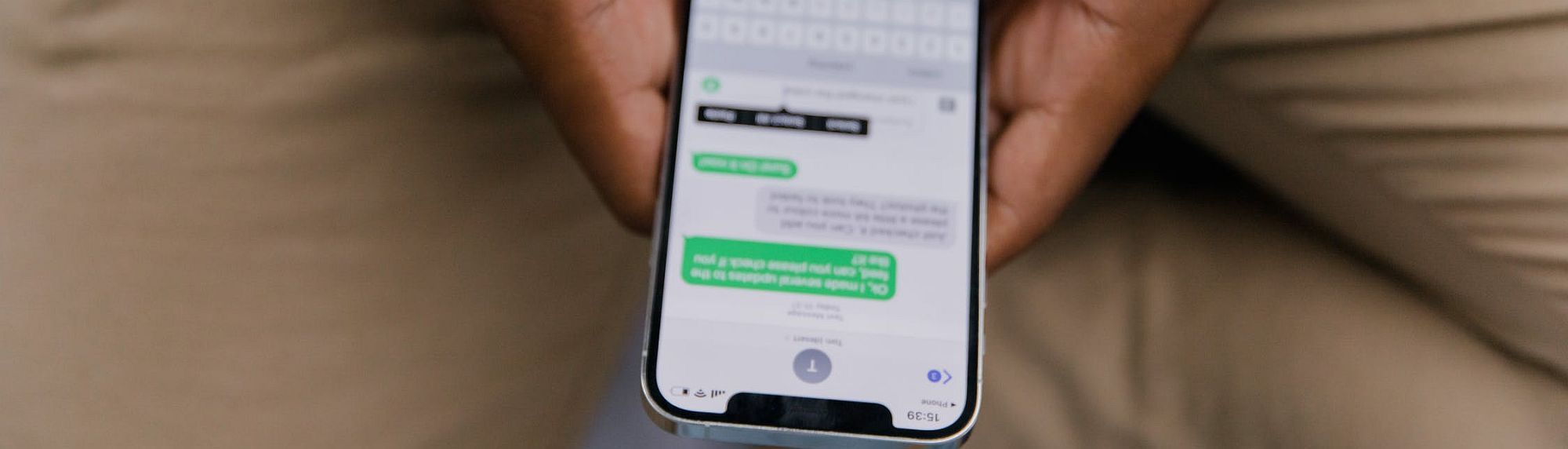 Close-Up View of Man Texting on Phone